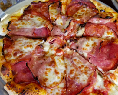 Sassafras Eclectic Food Joint signature dishes Asian Chicken Tacos
Muffaletta Pizza
Firecracker Burger